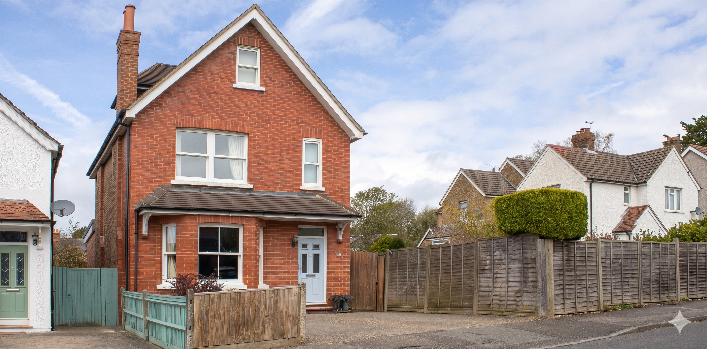 Victorian rear extension in Redhill Surrey with large glazed doors, rooflights and brick detailing connecting kitchen to garden patio