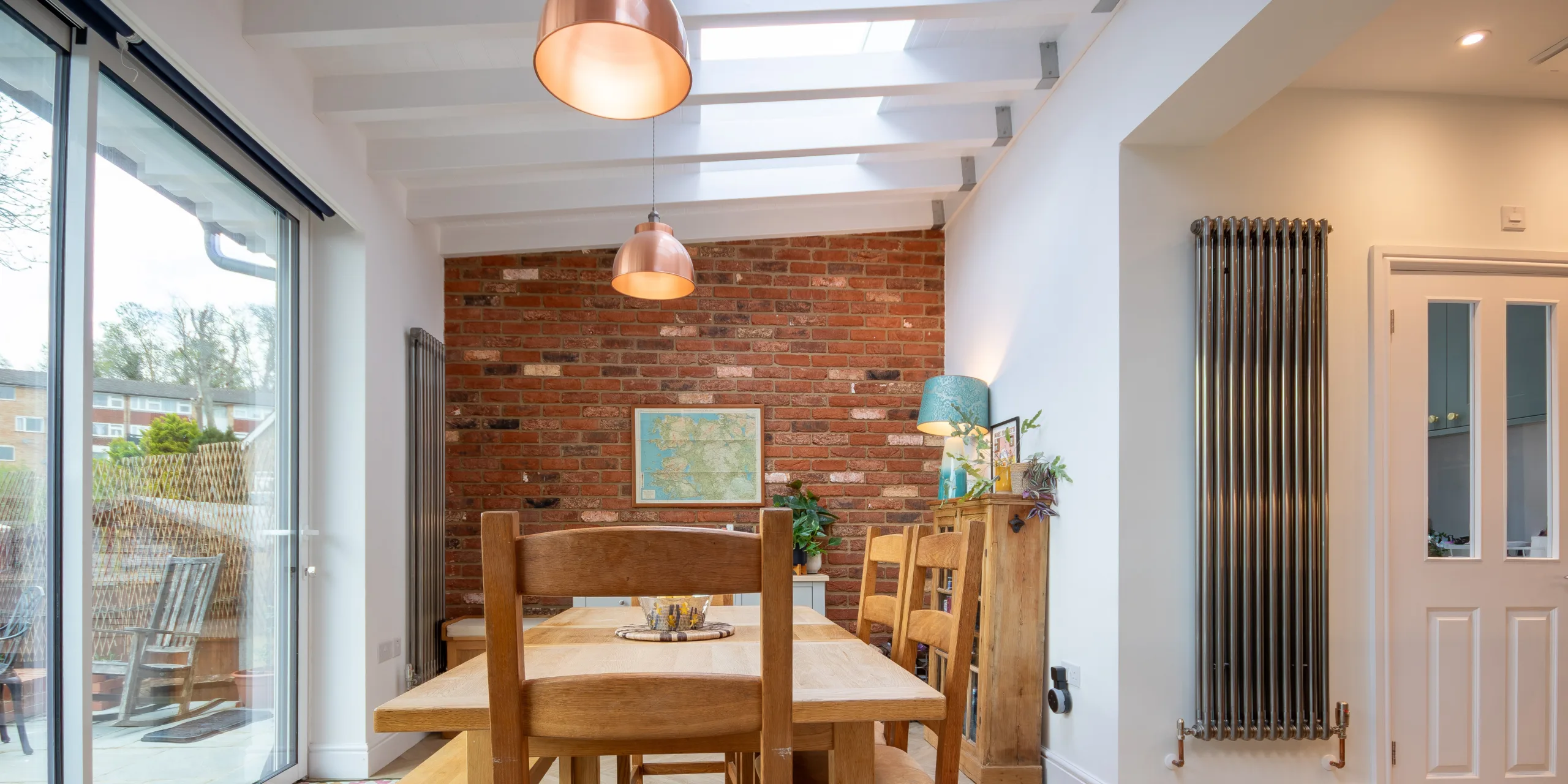 Open-plan kitchen dining space in Victorian extension with rooflights, island and natural light in Redhill Surrey