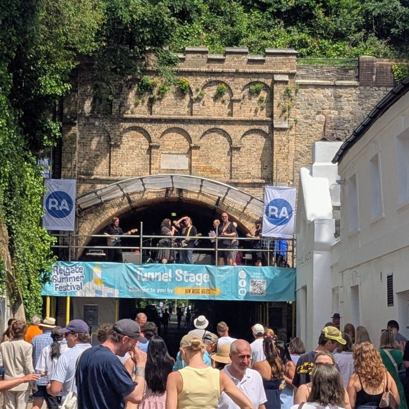 The completed Tunnel Stage at Reigate Summer Festival, designed by Reigate Architects using the historic Reigate Tunnel as the backdrop.